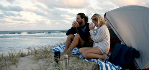 Man and women camping on beach, Queensland Australia
